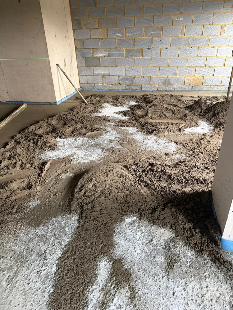 Sand and cement screed laid straight onto the wet bonding coat