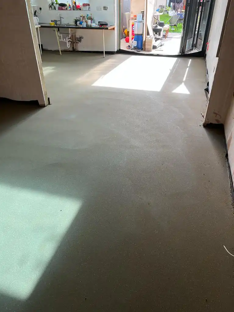 Bright finished floor screed in a domestic room ready for flooring