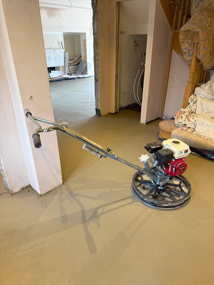 Power floated sand and cement screed with the machine in shot