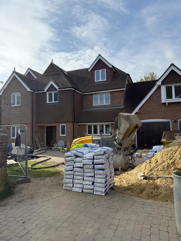 Sand and cement delivered to a house for a floor screeding job