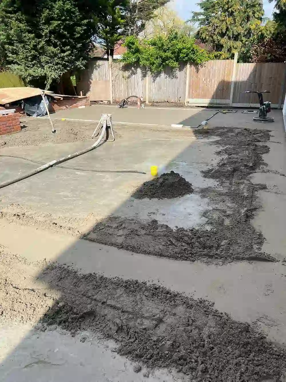 Screed being laid along an outdoor strip