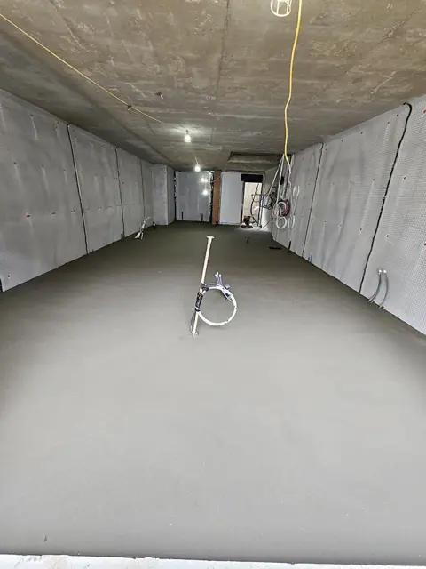 Commercial corridor with a freshly laid floor screed