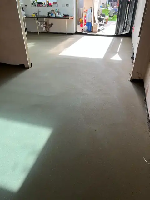 Bright finished floor screed in a domestic room ready for flooring