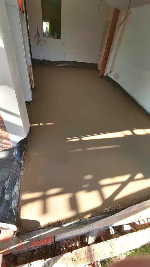 Sunlit corridor with a newly finished floor screed