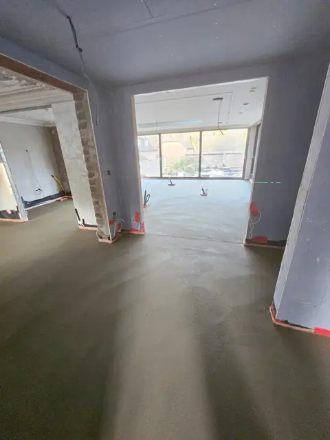 Large open plan room with a finished floor screed