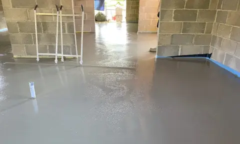 Wide bright room with a newly finished floor screed