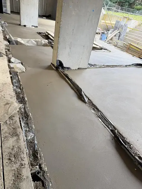 Membrane and screed pump hose laid out before a pour
