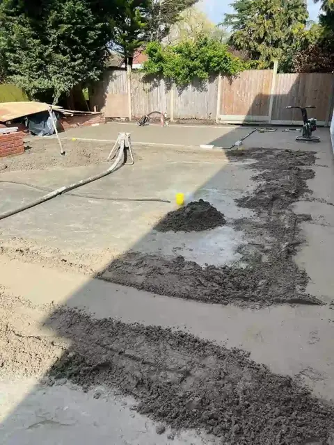 Screed being laid along an outdoor strip